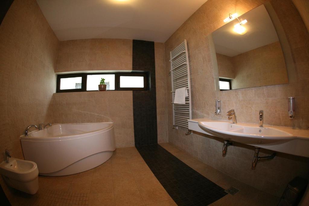 Bathroom with corner soaking tub and double sink