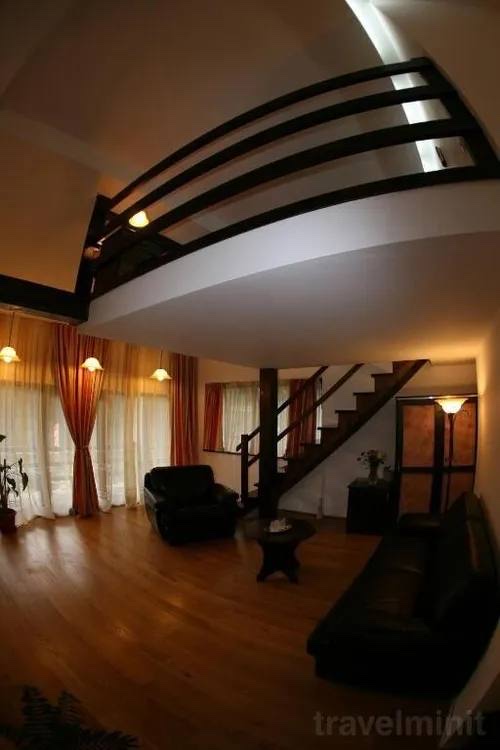 Camera Cvadrupla Deluxe cu Balcon — seating area